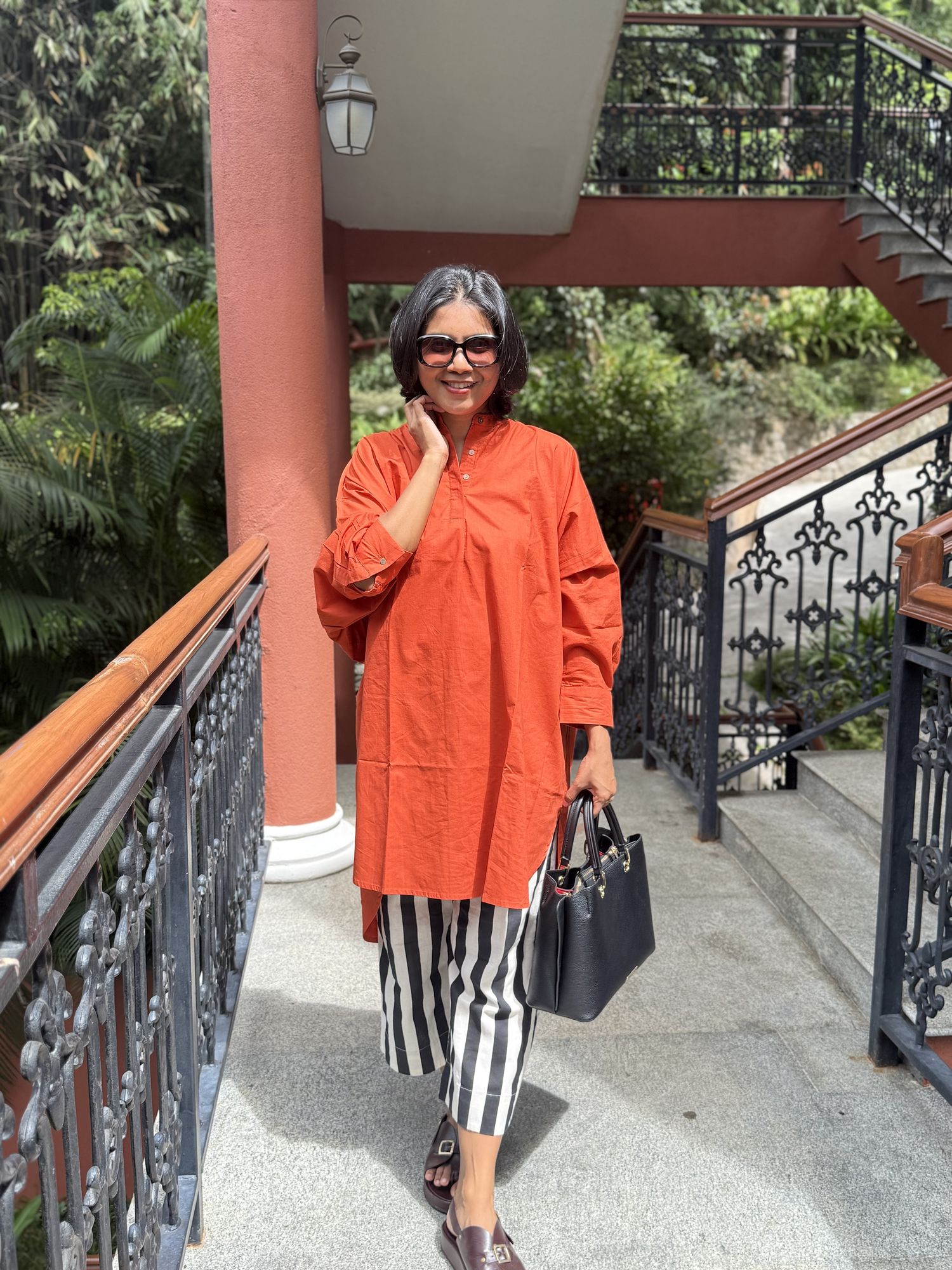 Orange tunic with striped trousers